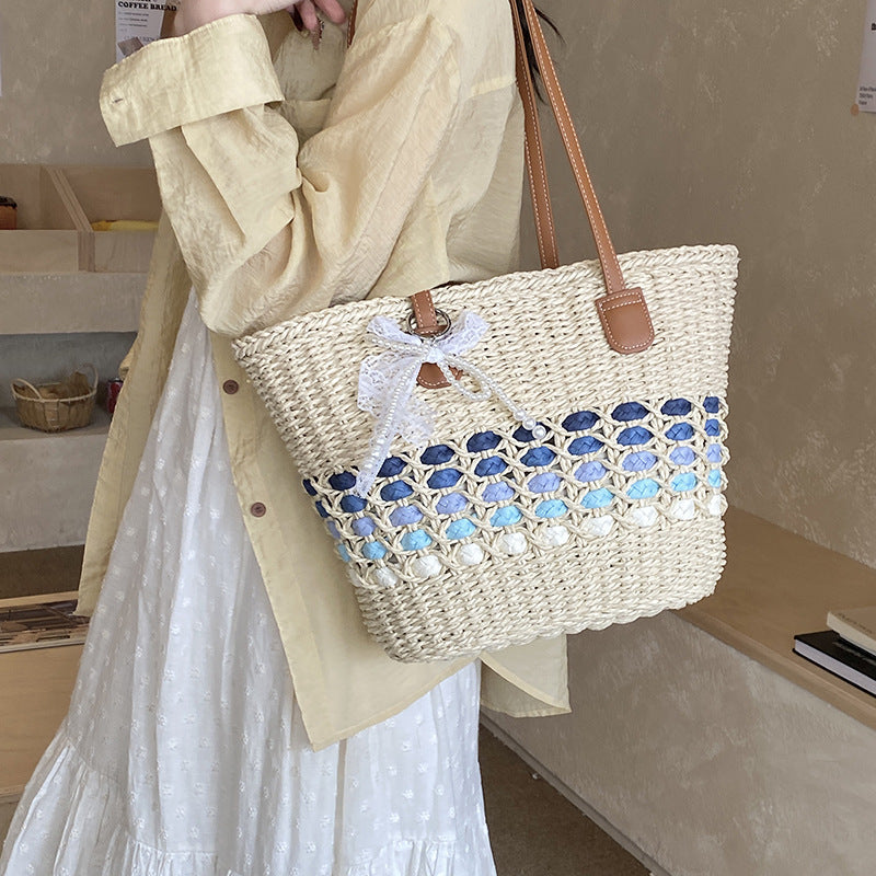 Woven Straw Beach Tote with Floral Accents and Leather-Like Handles