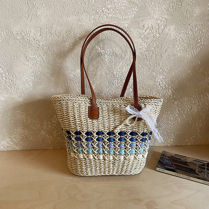 Woven Straw Beach Tote with Floral Accents and Leather-Like Handles