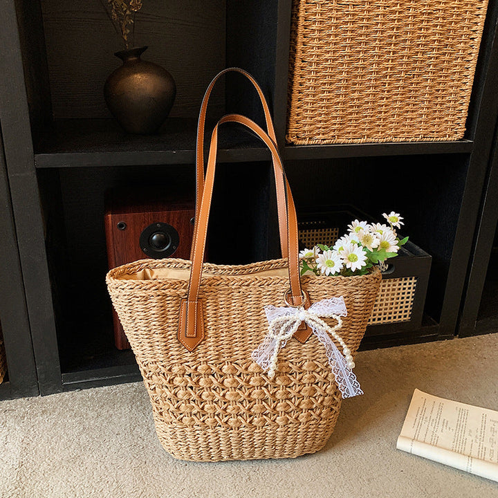 Woven Straw Beach Tote with Floral Accents and Leather-Like Handles