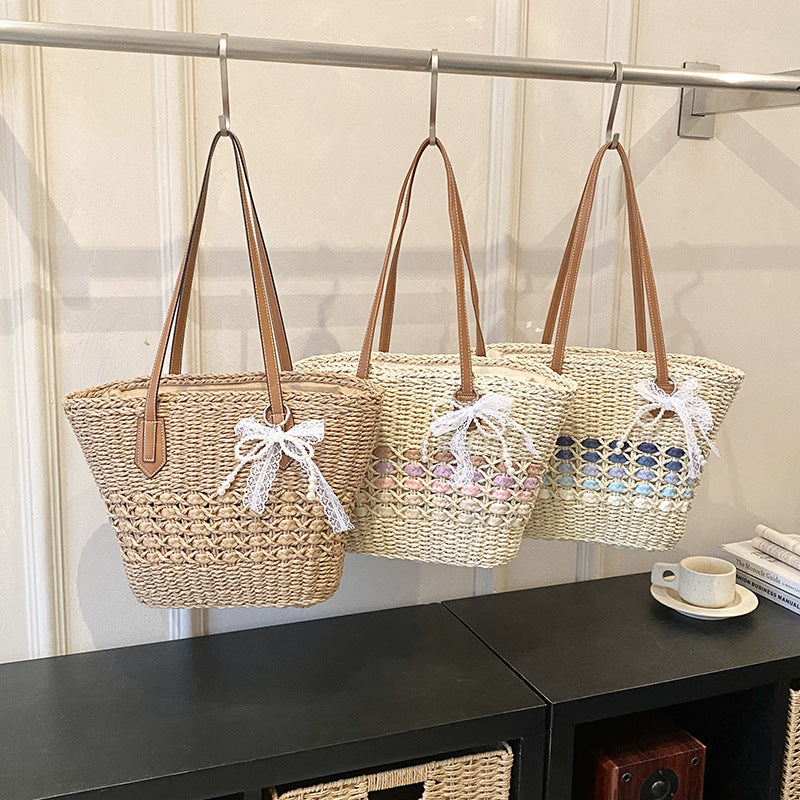 Woven Straw Beach Tote with Floral Accents and Leather-Like Handles