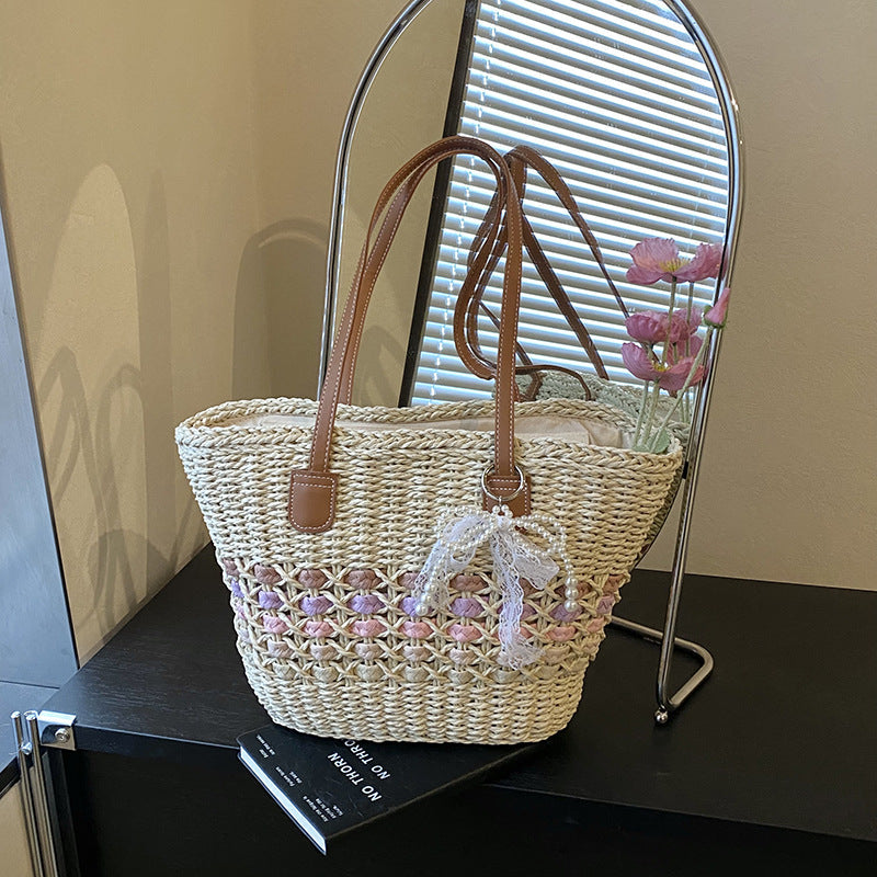 Woven Straw Beach Tote with Floral Accents and Leather-Like Handles
