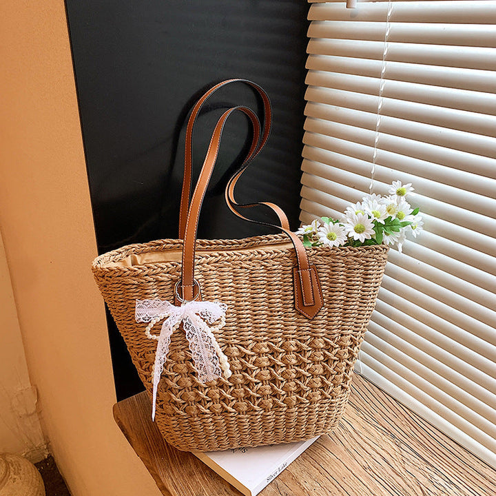 Woven Straw Beach Tote with Floral Accents and Leather-Like Handles